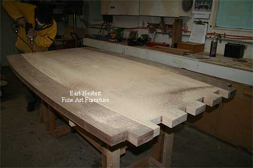 Earl drilling tenons on end of custom made dining table showing tenons